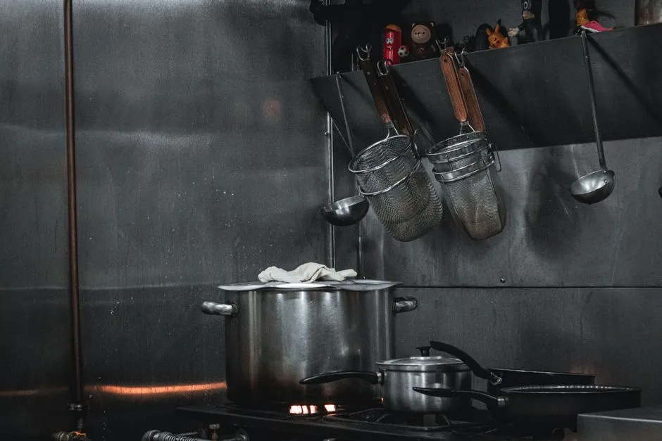 Stainless steel commercial kitchen hood above cooking line in Egg Harbor Township restaurant